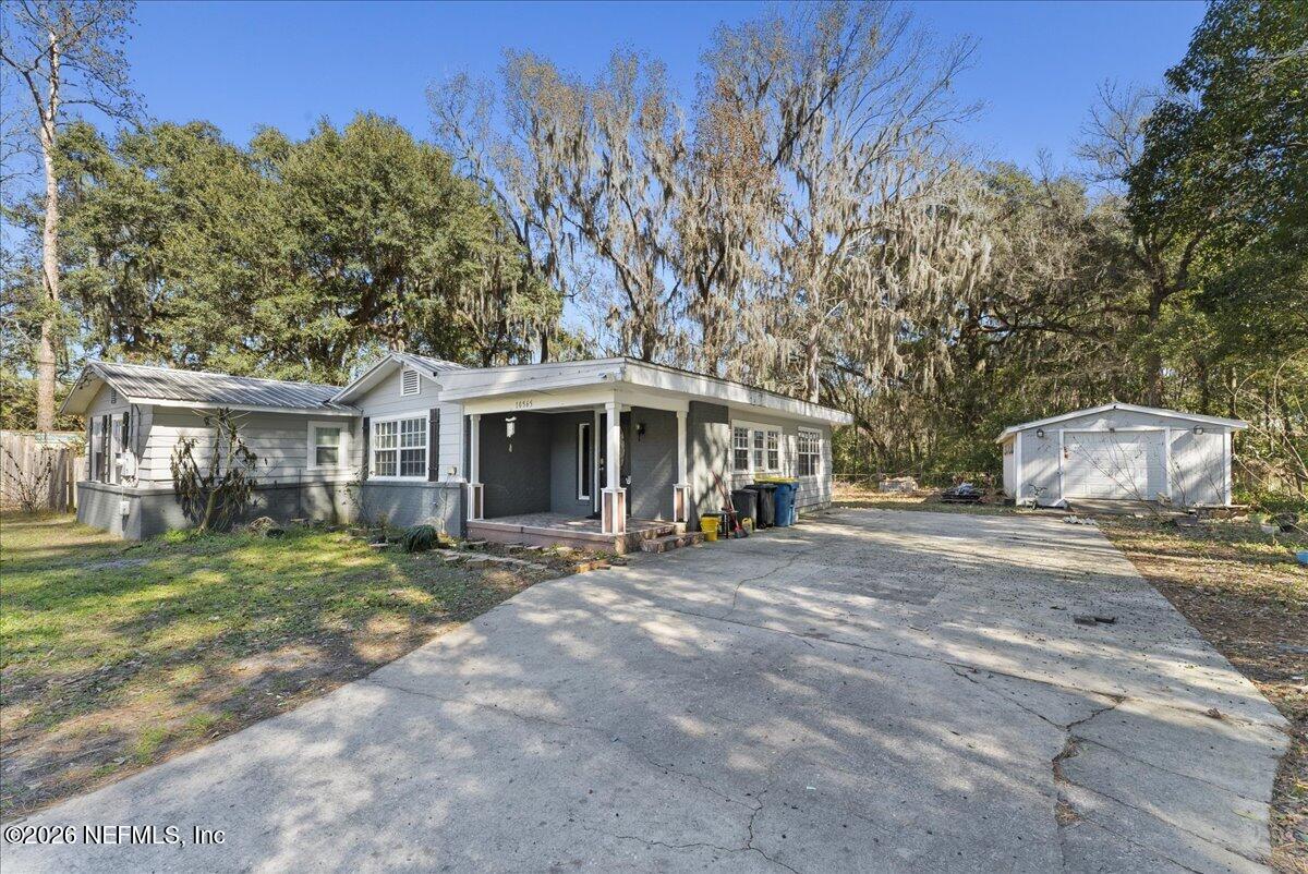 10565 Bessent Road North Jacksonville, FL 32218 - Photo 2 of 27 a view of a house with a yard