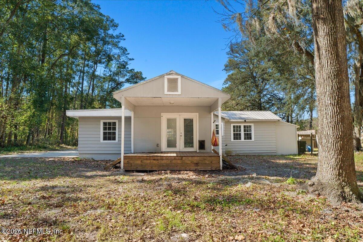 10565 Bessent Road North Jacksonville, FL 32218 - Photo 23 of 27 a front view of a house with a yard