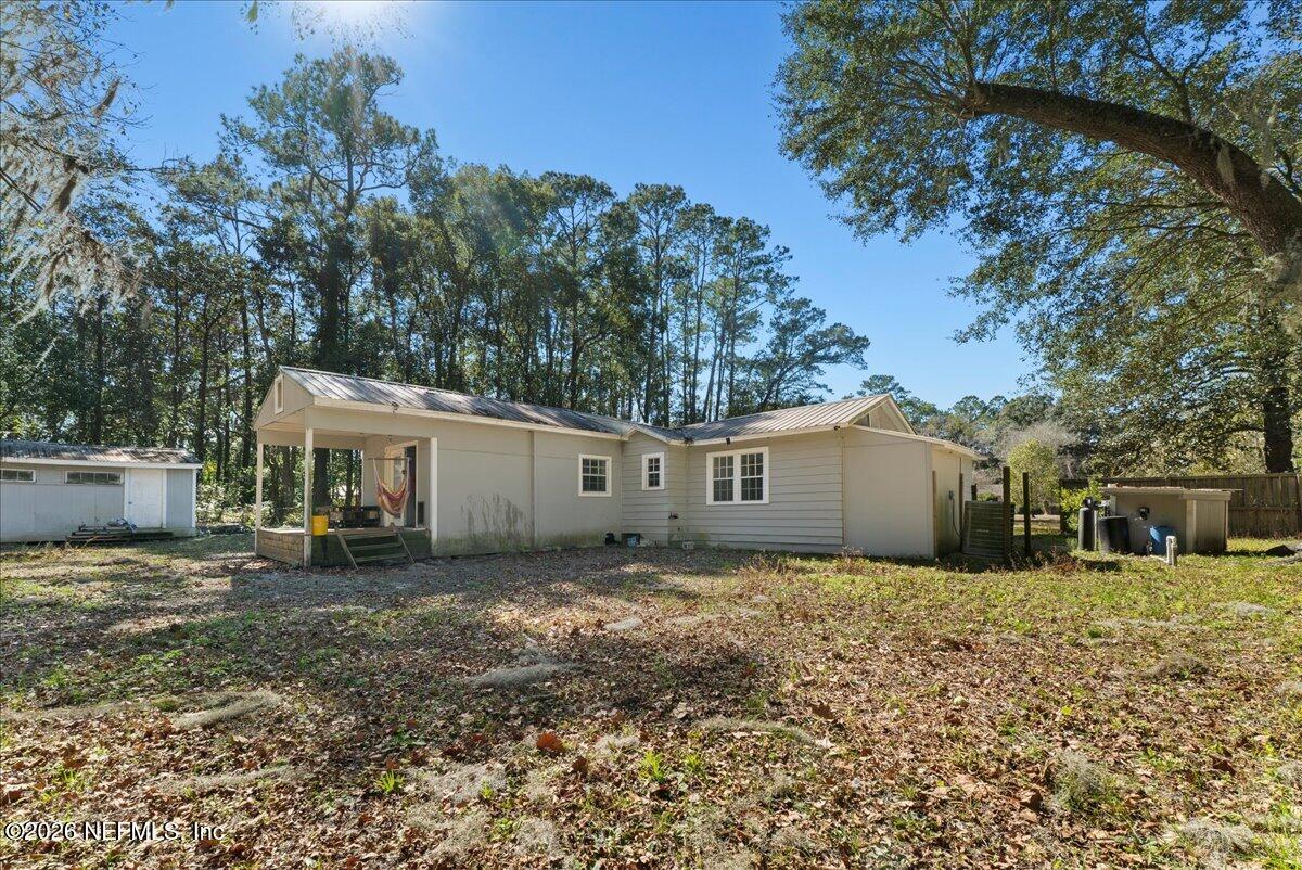 10565 Bessent Road North Jacksonville, FL 32218 - Photo 26 of 27 a view of a house with a yard