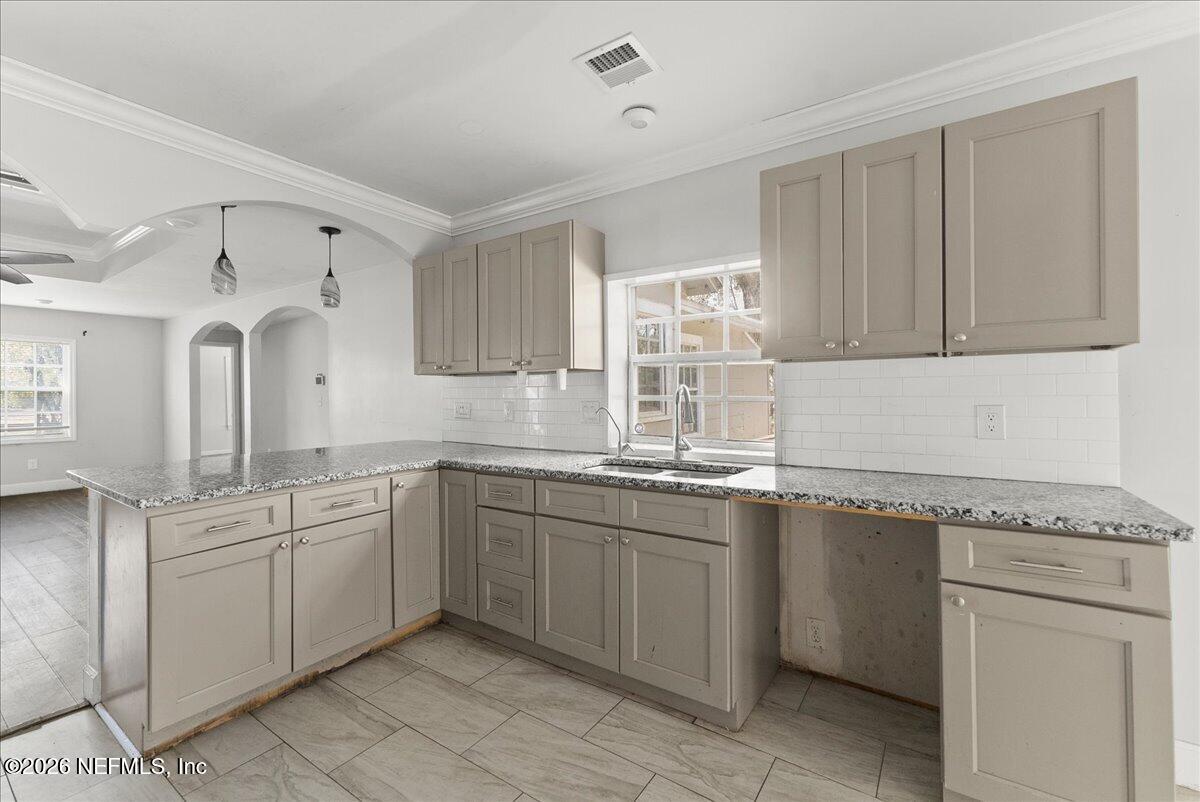 10565 Bessent Road North Jacksonville, FL 32218 - Photo 5 of 27 a kitchen with a sink cabinets and window