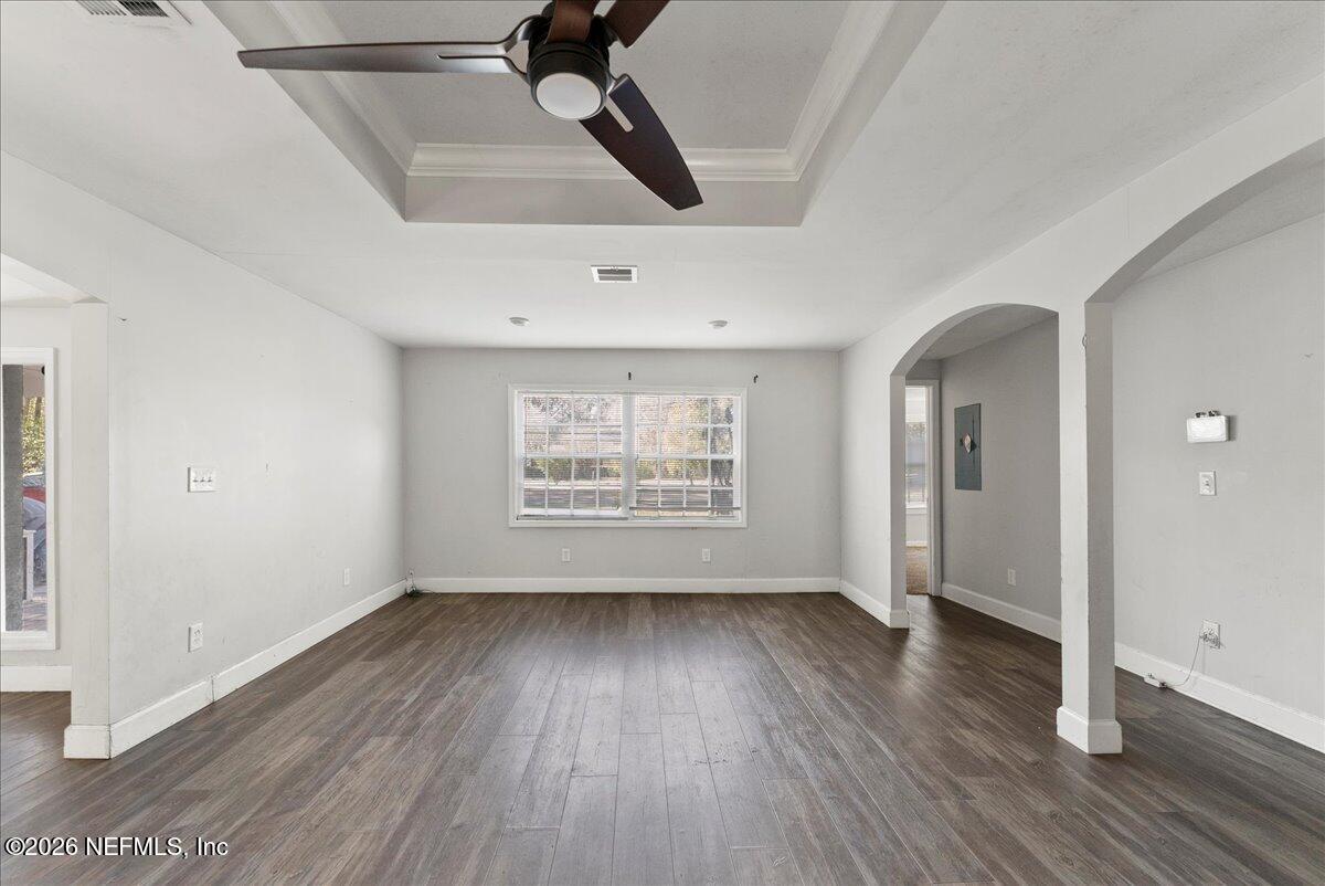 10565 Bessent Road North Jacksonville, FL 32218 - Photo 8 of 27 wooden floor in an empty room with a window