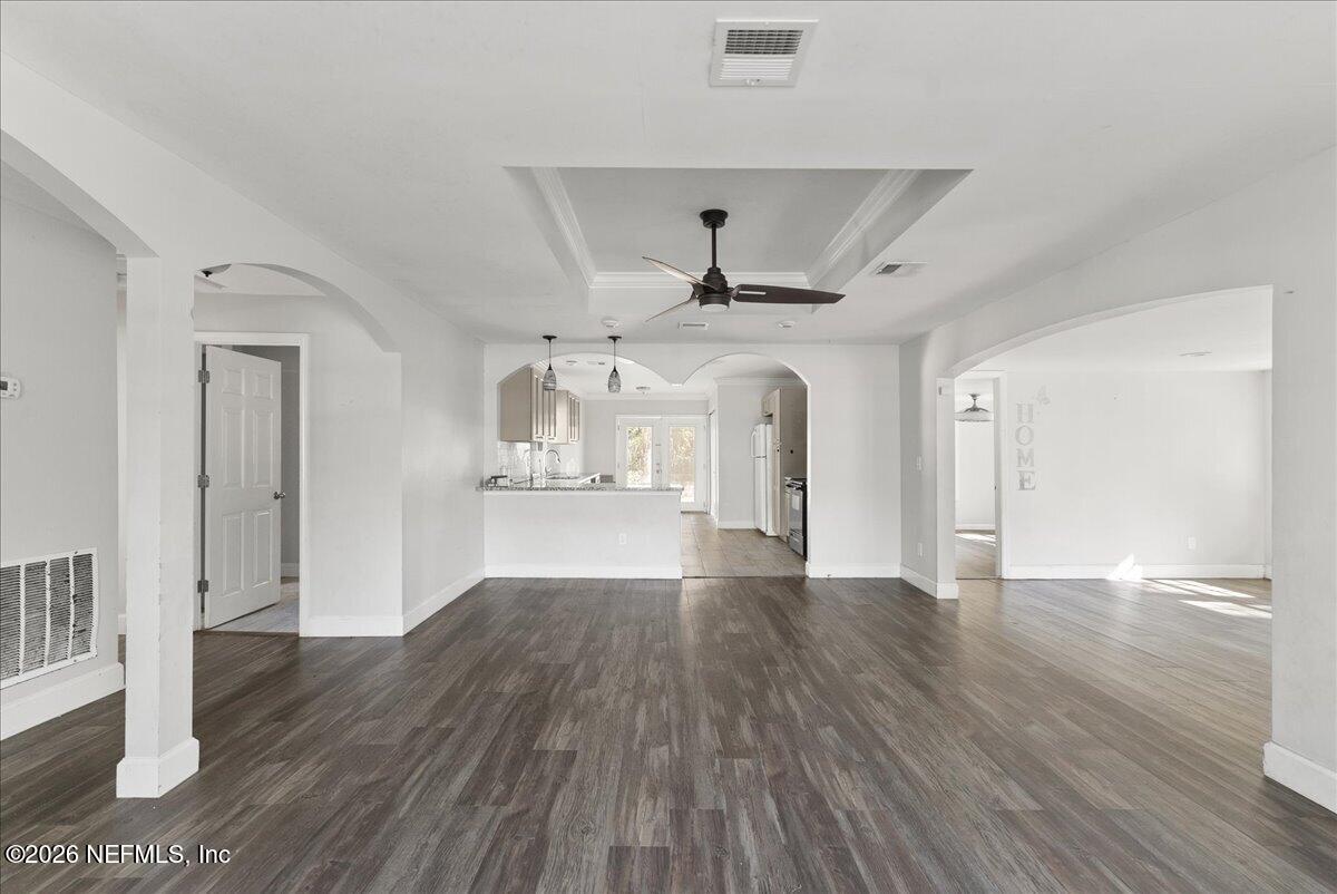 10565 Bessent Road North Jacksonville, FL 32218 - Photo 9 of 27 a view of empty room with wooden floor