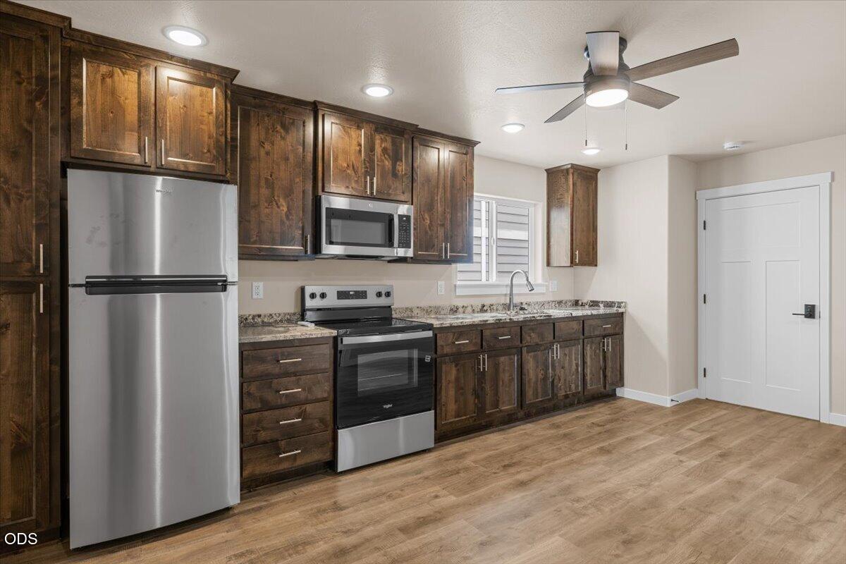 7869 Houston Loop White City, OR 97503 - Photo 8 of 15 a kitchen with stainless steel appliances granite countertop a refrigerator stove and sink