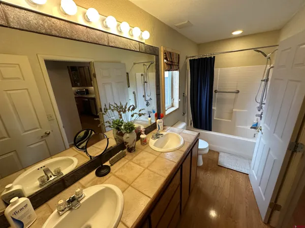 a bedroom with double bed and a window