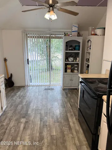 a view of an empty room with a fireplace