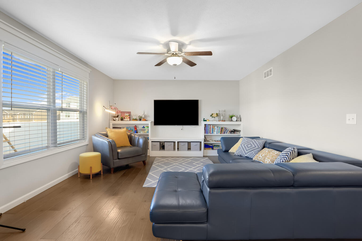 807 Cates Drive Mahomet, IL 61853 - Photo 12 of 33 a living room with furniture and a flat screen tv