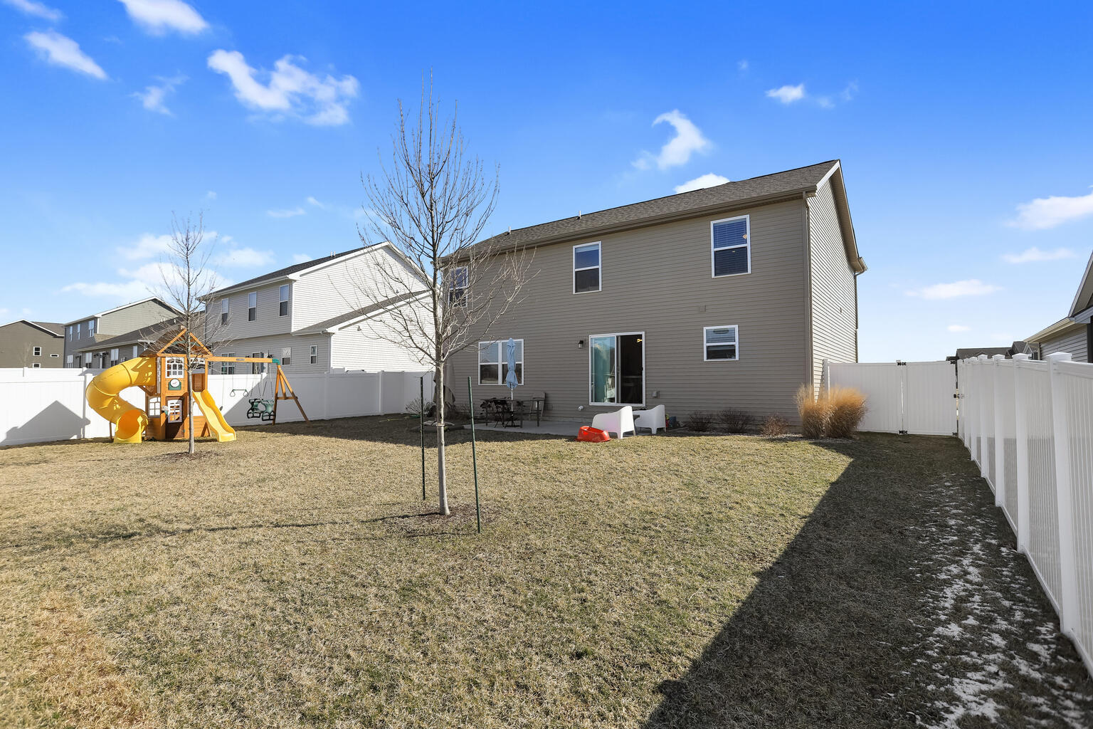 807 Cates Drive Mahomet, IL 61853 - Photo 2 of 33 a view of a house with a backyard
