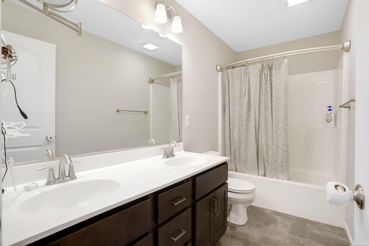 807 Cates Drive Mahomet, IL 61853 - Photo 21 of 33 a bathroom with a double vanity sink toilet and shower
