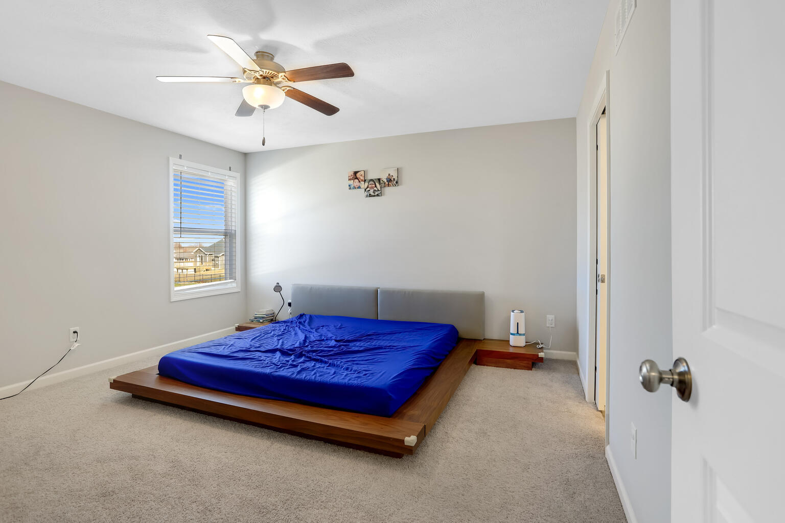 807 Cates Drive Mahomet, IL 61853 - Photo 23 of 33 a bedroom with a bed and a ceiling fan