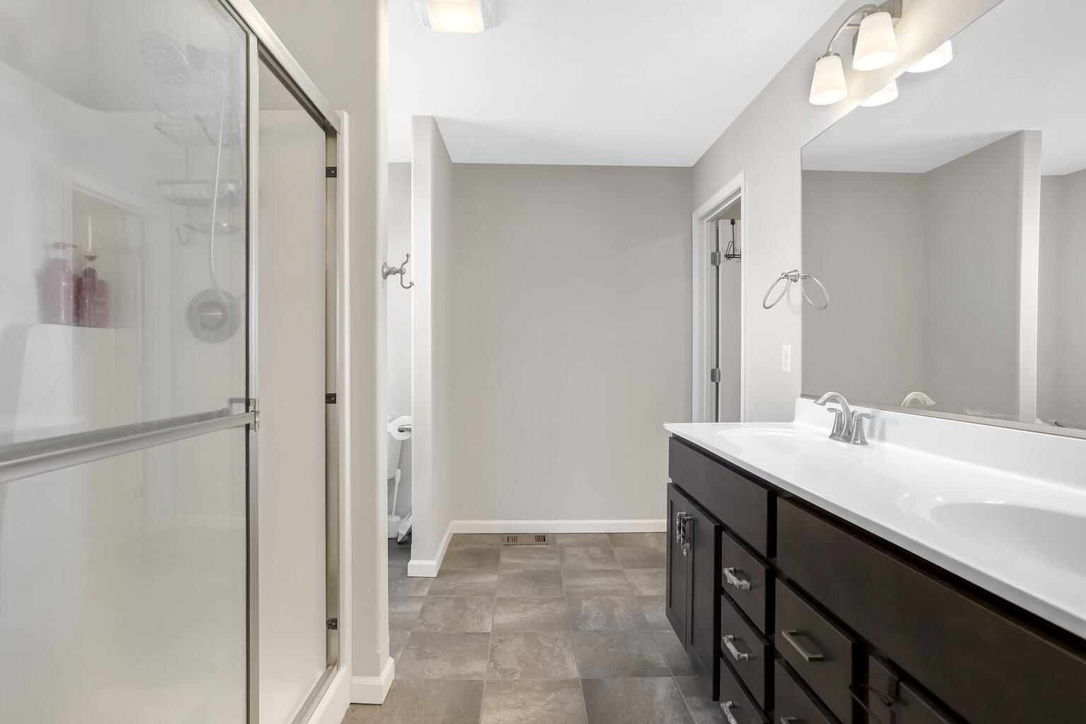 807 Cates Drive Mahomet, IL 61853 - Photo 26 of 33 a bathroom with a sink and a mirror