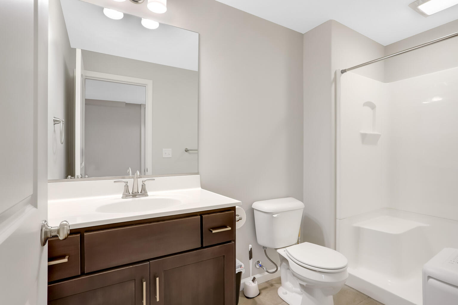 807 Cates Drive Mahomet, IL 61853 - Photo 30 of 33 a bathroom with a sink toilet vanity and shower