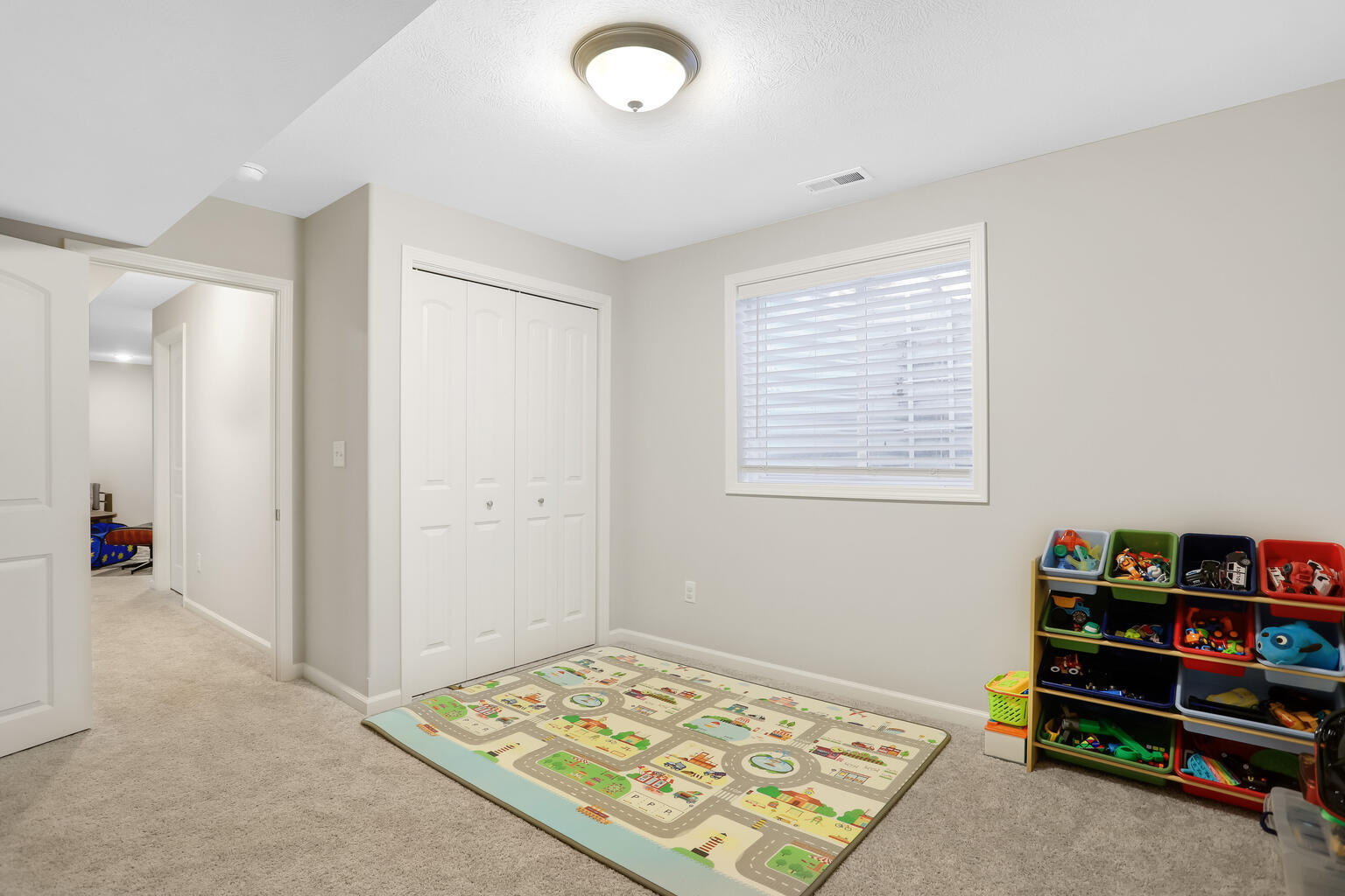 807 Cates Drive Mahomet, IL 61853 - Photo 32 of 33 a view of a bedroom with baby crib and toys