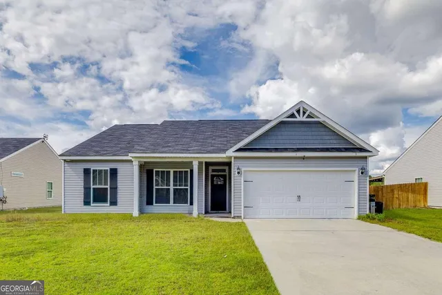 a front view of a house with yard