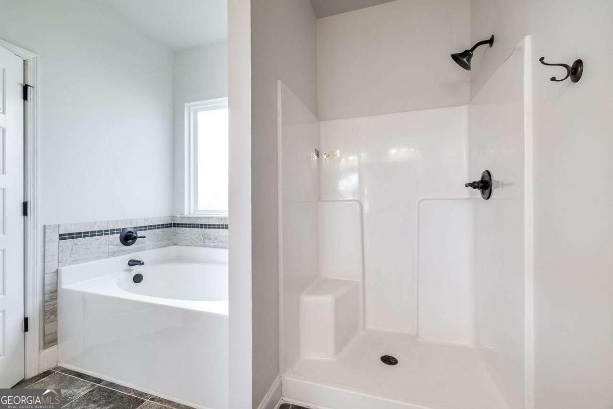 208 Timberlake Lane Guyton, GA 31312 - Photo 17 of 24 a bathroom with a bathtub