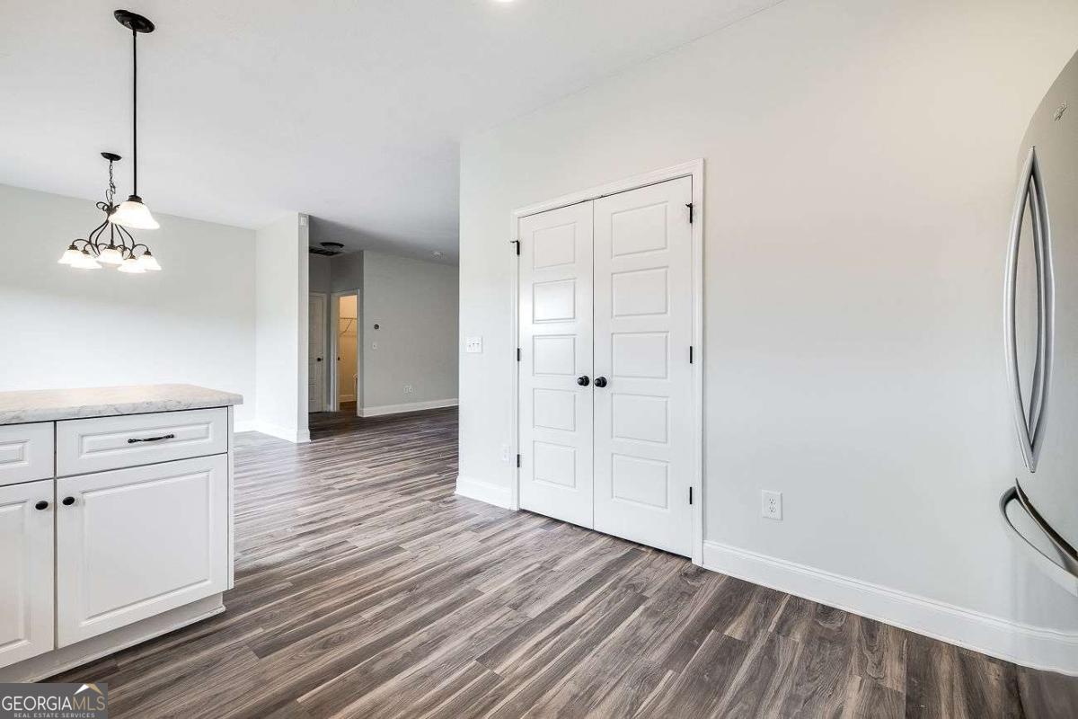 208 Timberlake Lane Guyton, GA 31312 - Photo 10 of 24 a view of a room with wooden floor