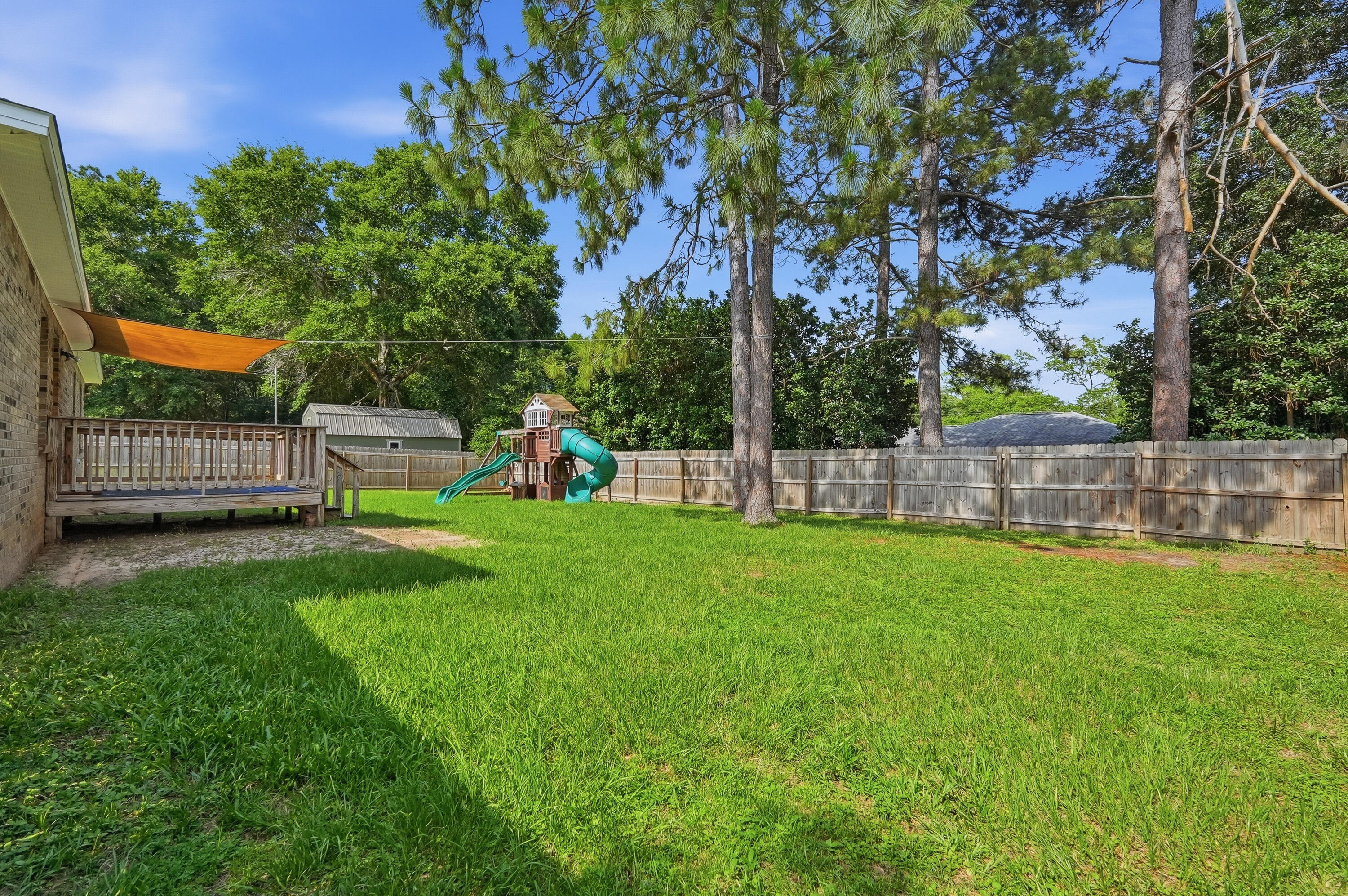 3033 Cabela Lane Crestview, FL 32539 - Photo 2 of 32 a view of a garden with a slide