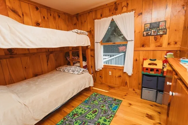 a bedroom with a bed and a table