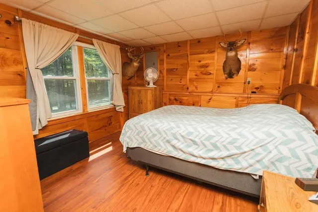 a bedroom with a bed and a shower