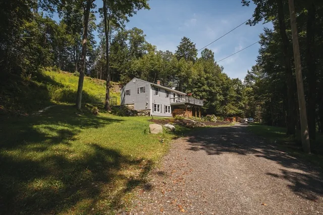 a view of a balcony with wooden floor and fence