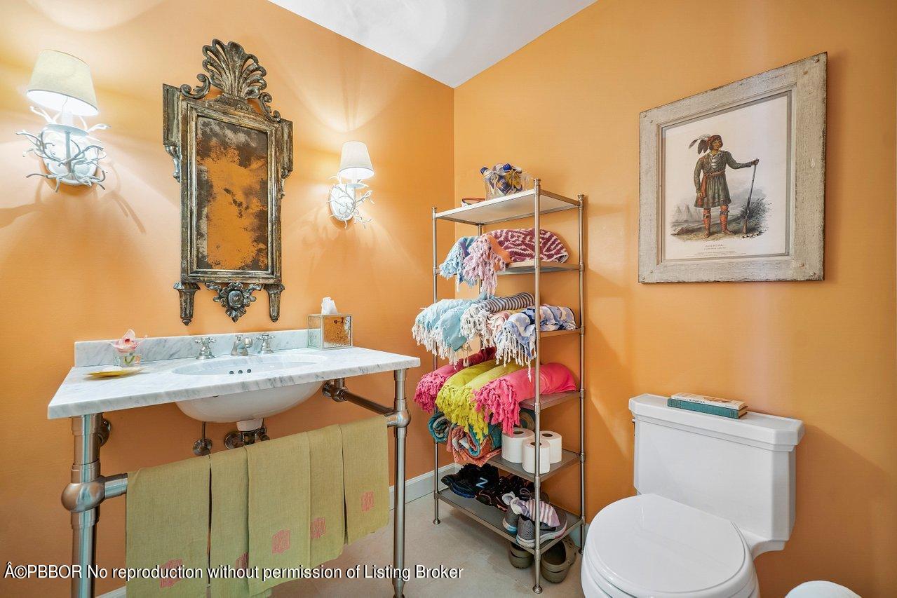 4333 North Ocean Boulevard, Unit BS2 Boca Raton, FL 33431 - Photo 12 of 22 a bathroom with a sink mirror vanity and toilet