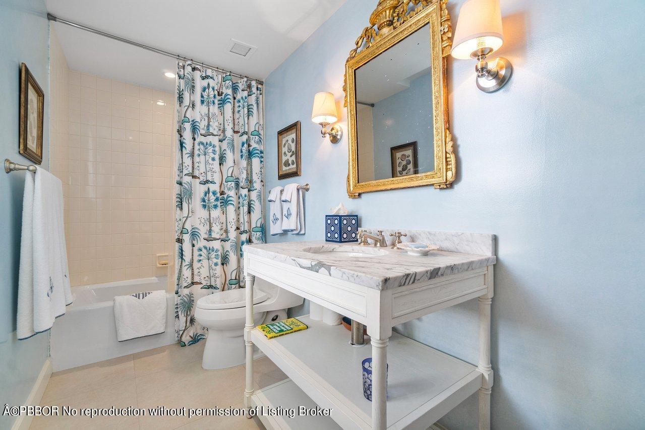 4333 North Ocean Boulevard, Unit BS2 Boca Raton, FL 33431 - Photo 13 of 22 a bathroom with a sink mirror and a bathtub