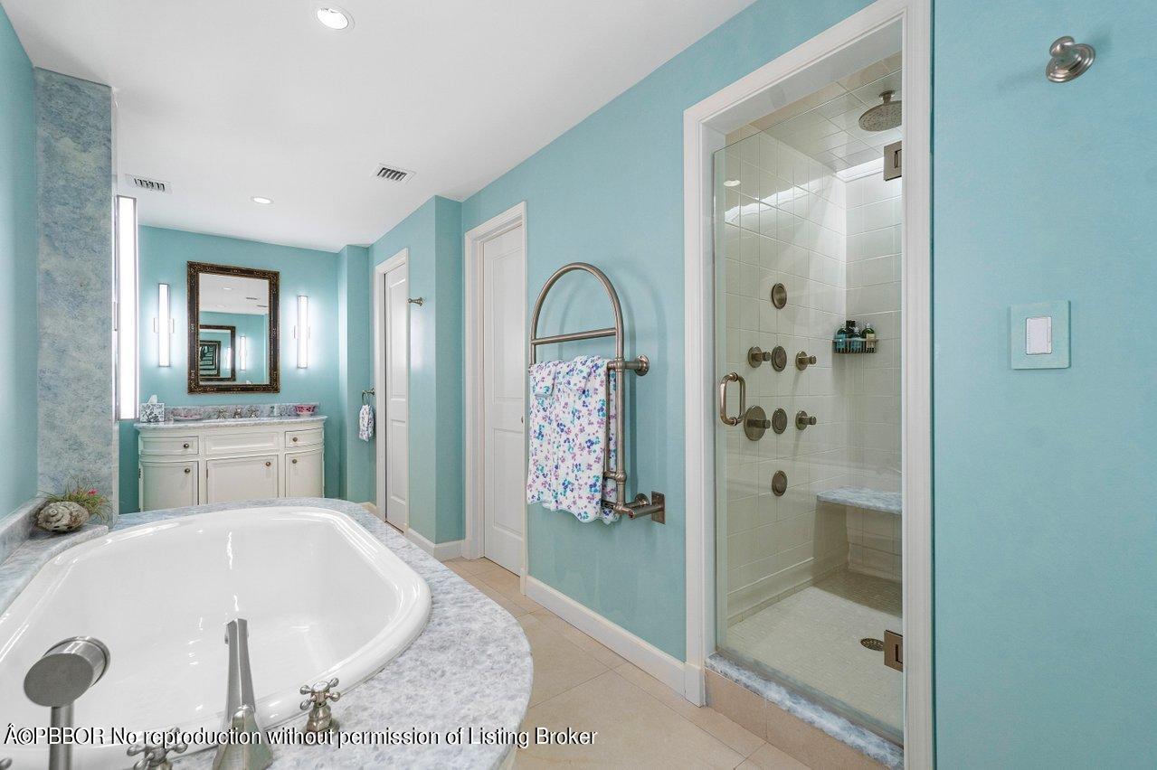 4333 North Ocean Boulevard, Unit BS2 Boca Raton, FL 33431 - Photo 16 of 22 a bathroom with a bathtub and a shower