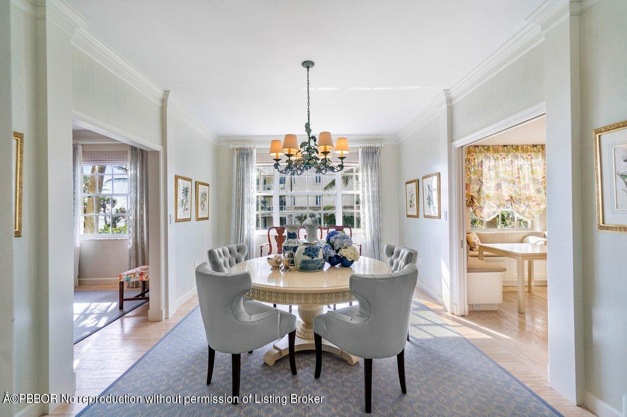 4333 North Ocean Boulevard, Unit BS2 Boca Raton, FL 33431 - Photo 6 of 22 a dining room with furniture a chandelier and wooden floor