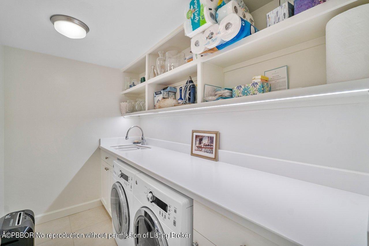 4333 North Ocean Boulevard, Unit BS2 Boca Raton, FL 33431 - Photo 8 of 22 a utility room with dryer and washer