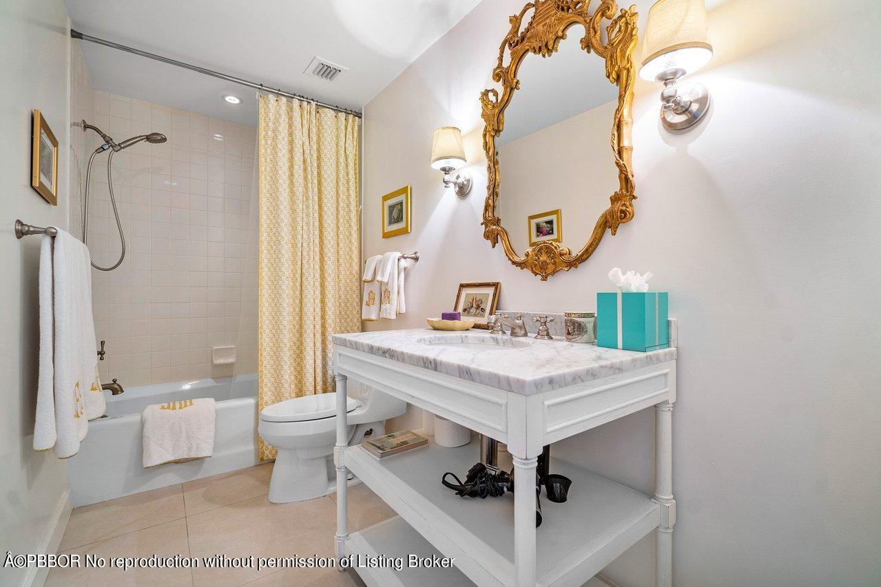 4333 North Ocean Boulevard, Unit BS2 Boca Raton, FL 33431 - Photo 10 of 22 a bathroom with a sink mirror and a toilet