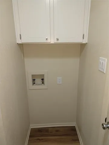 a view of small space with wooden floor