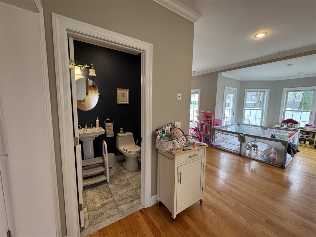 43 Canterbury Road Waltham, MA 02453 - Photo 13 of 42 a lobby with furniture and wooden floor