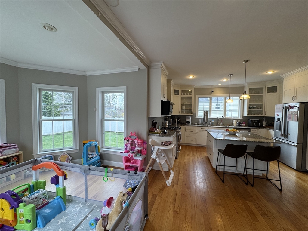 43 Canterbury Road Waltham, MA 02453 - Photo 14 of 42 a living room with furniture and a wooden floor