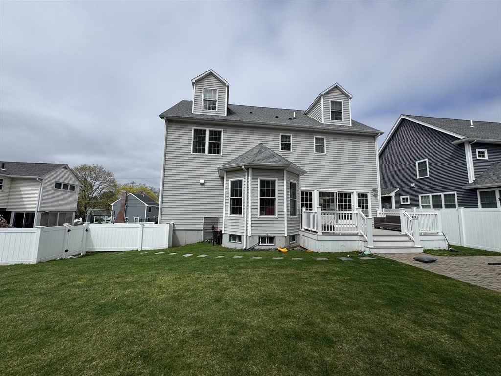 43 Canterbury Road Waltham, MA 02453 - Photo 3 of 42 a front view of a house with a yard