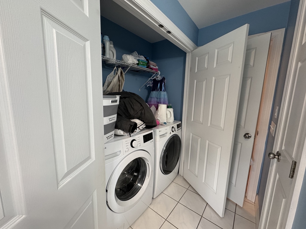 43 Canterbury Road Waltham, MA 02453 - Photo 31 of 42 a utility room with dryer and washer