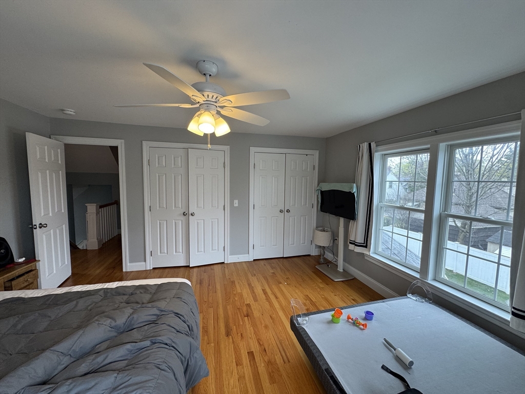 43 Canterbury Road Waltham, MA 02453 - Photo 33 of 42 a bedroom with a bed and a large window