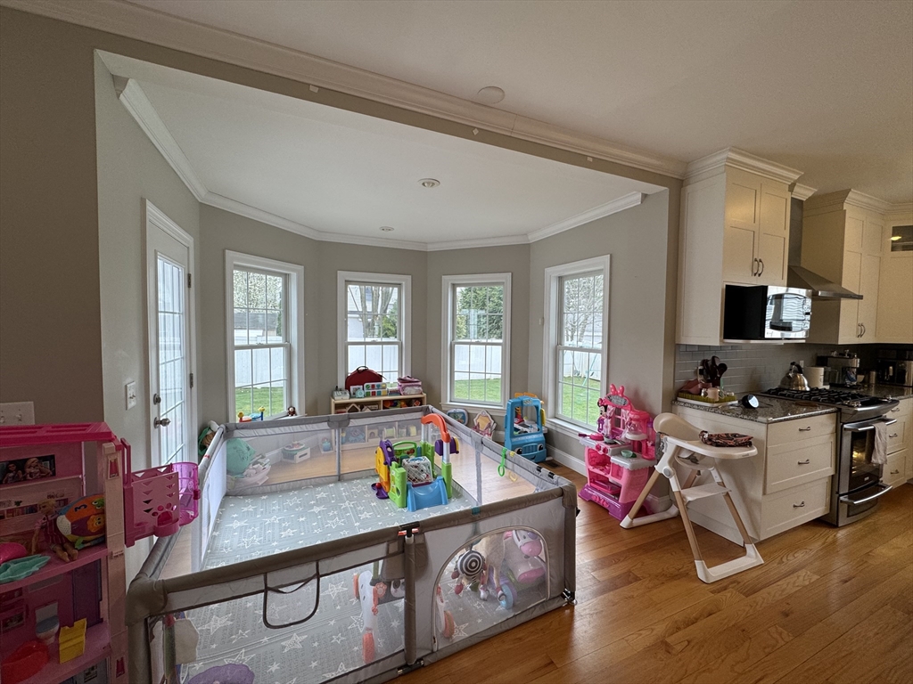 43 Canterbury Road Waltham, MA 02453 - Photo 41 of 42 a playing room with furniture and a wooden floor