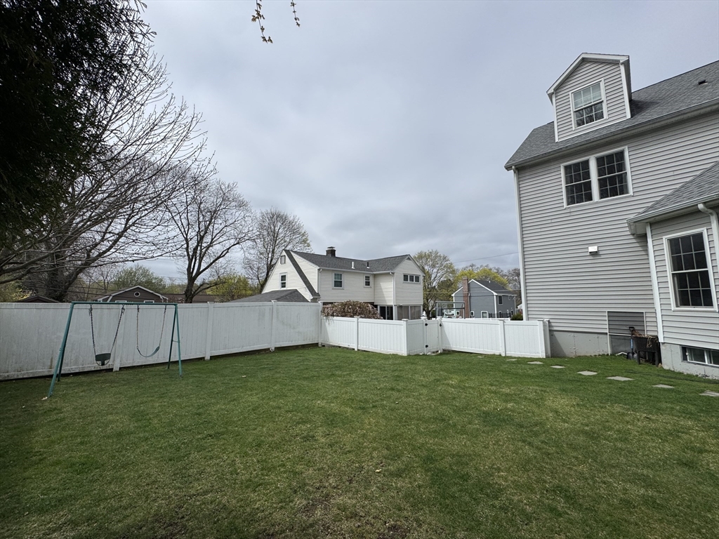 43 Canterbury Road Waltham, MA 02453 - Photo 5 of 42 a view of a house with a yard and sitting area