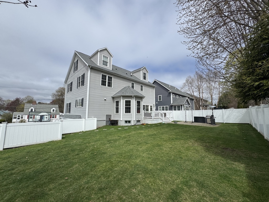43 Canterbury Road Waltham, MA 02453 - Photo 6 of 42 a front view of a house with a yard and trees