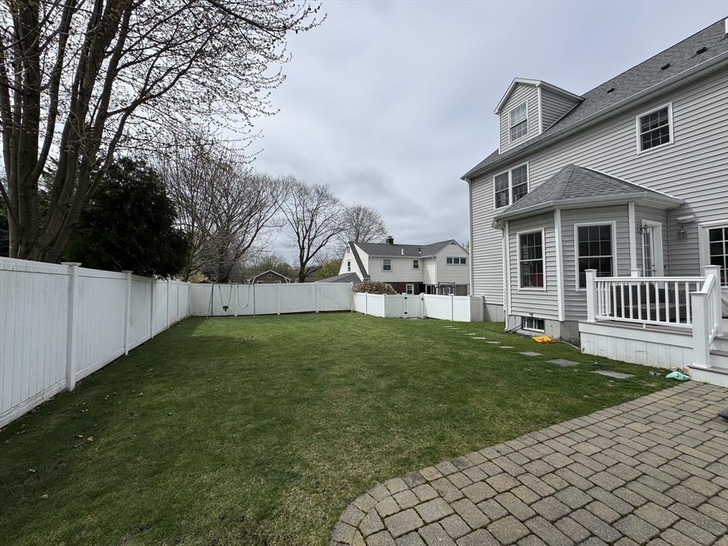 43 Canterbury Road Waltham, MA 02453 - Photo 7 of 42 a view of a house with backyard and a tree