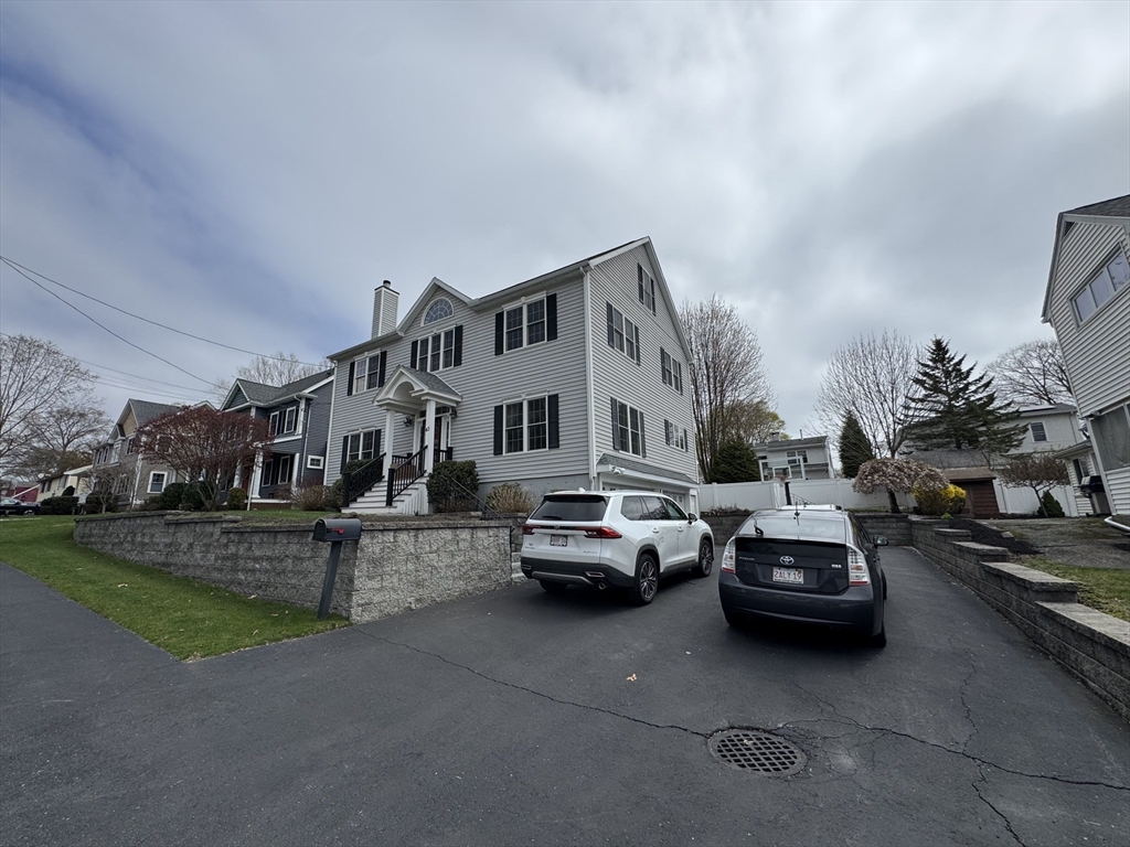 43 Canterbury Road Waltham, MA 02453 - Photo 8 of 42 a car parked in front of house