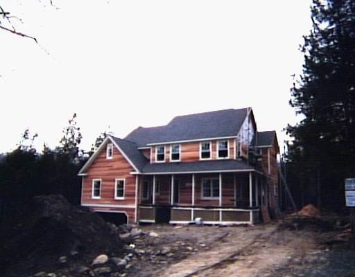 8 Butterfield Road Newtown, CT 06470 - Photo 1 of 1 a front view of a house with a garden