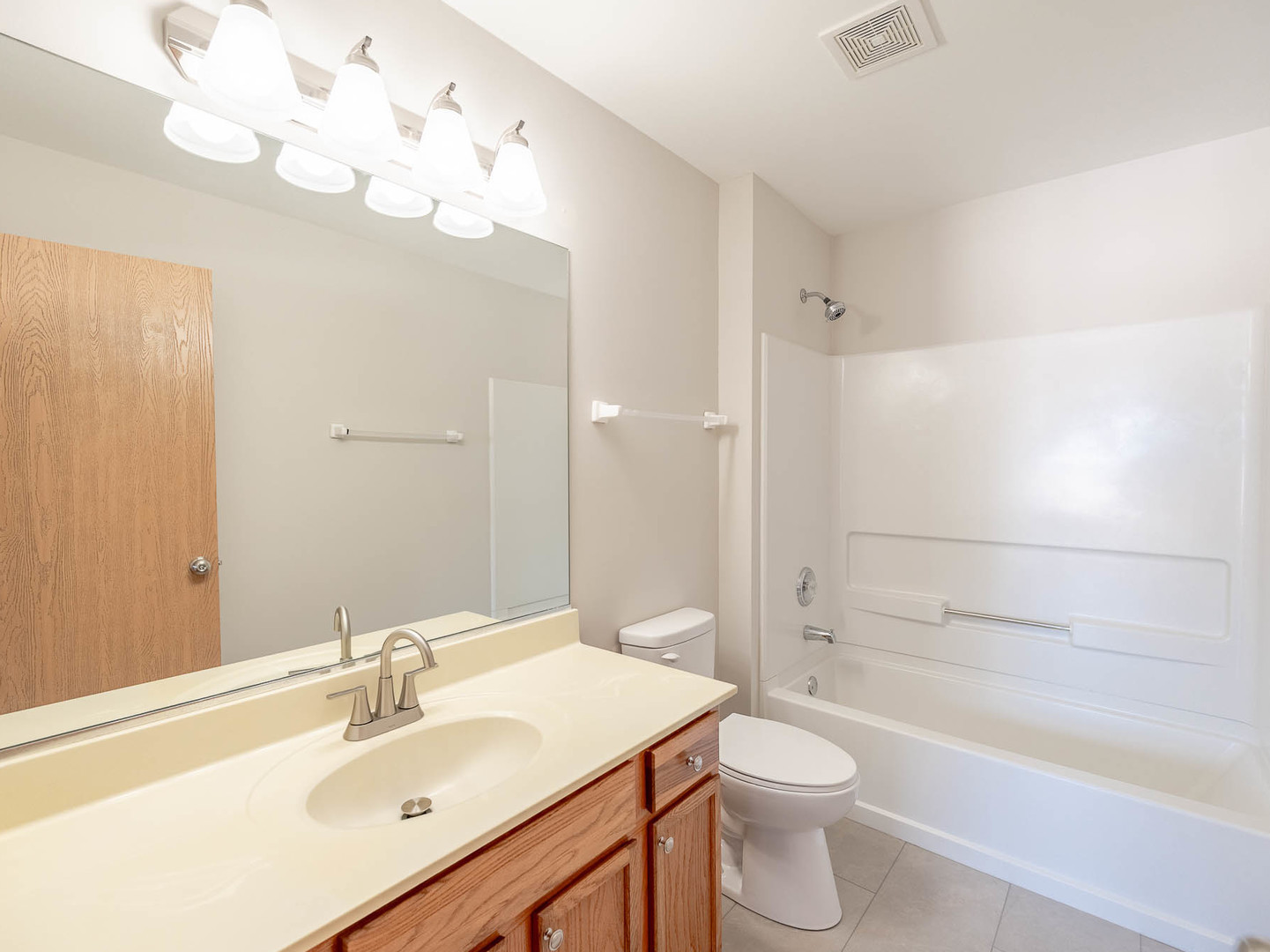 1648 McClure Road, Unit 1648 Aurora, IL 60505 - Photo 9 of 10 a bathroom with a sink a toilet and shower