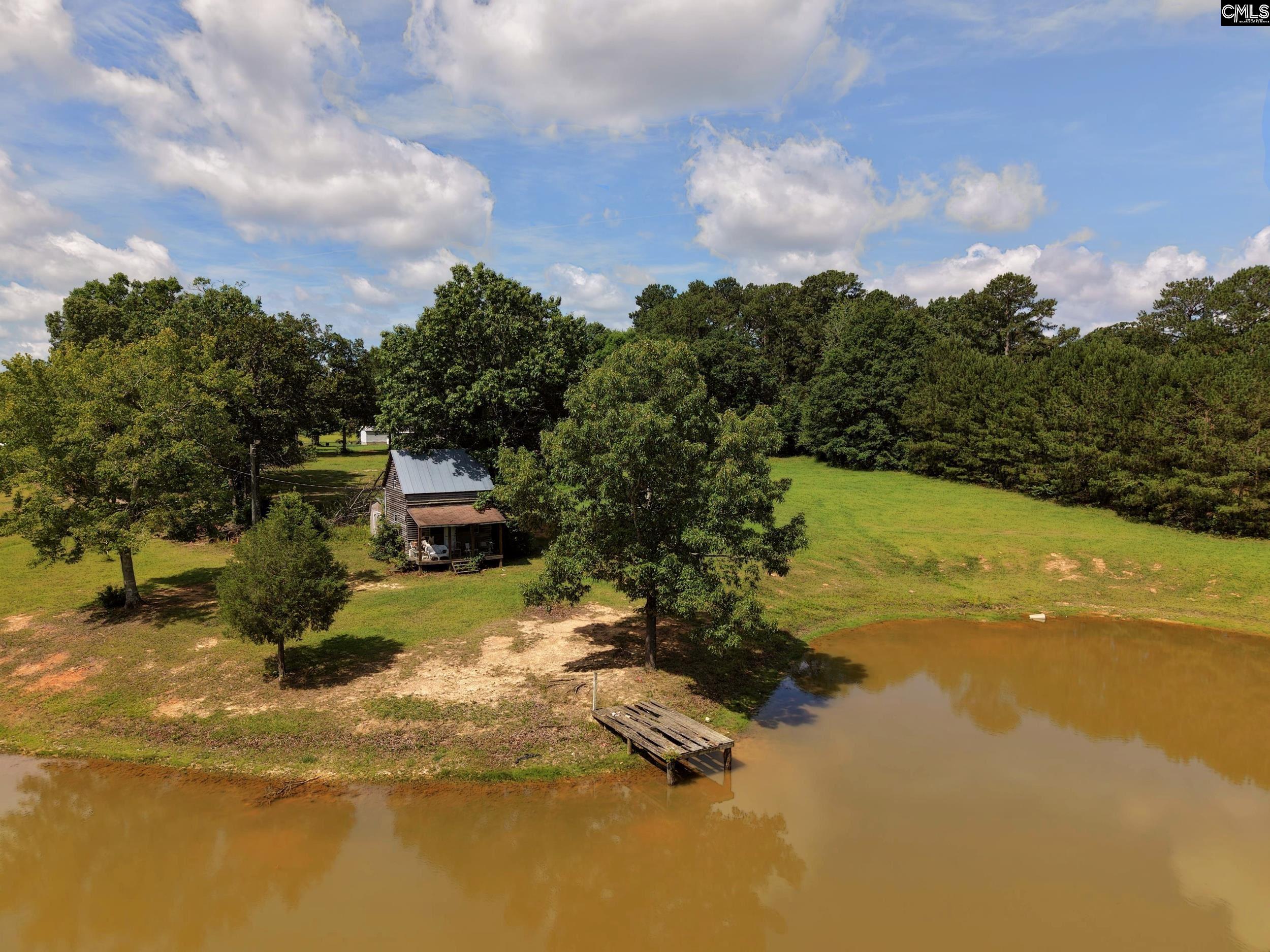 3140 Highway 702 Chappells, SC 29037 - Photo 11 of 39 a view of a lake with a houses