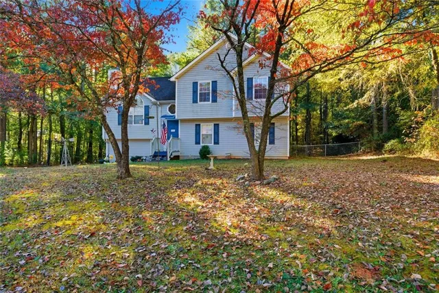 front view of a house with a large trees