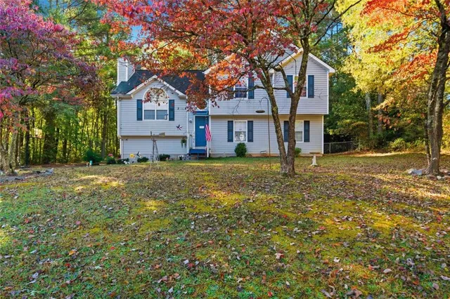 a front view of a house with a yard