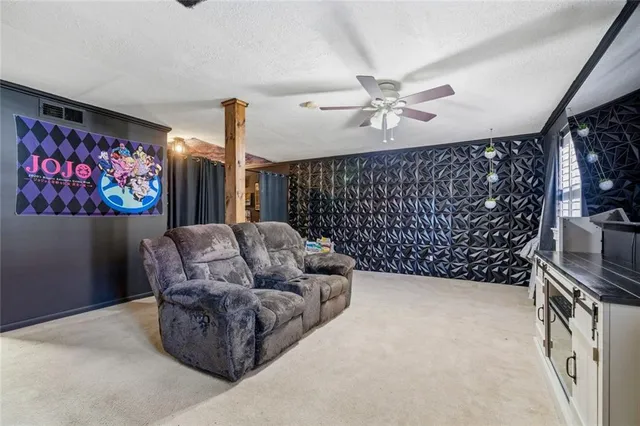 a living room with furniture a couch and a chandelier