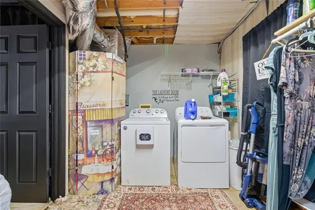 a utility room with dryer and washer
