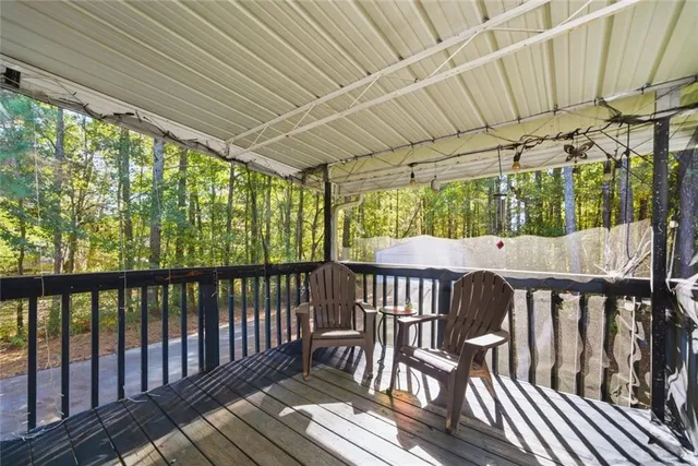 a view of a two chairs in the balcony