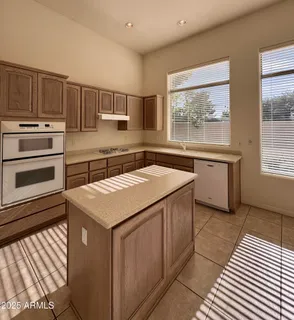 a kitchen with a stove a sink and a microwave