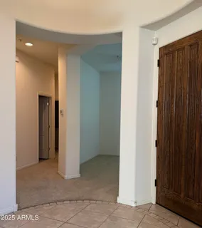 a view of an empty room with closet area